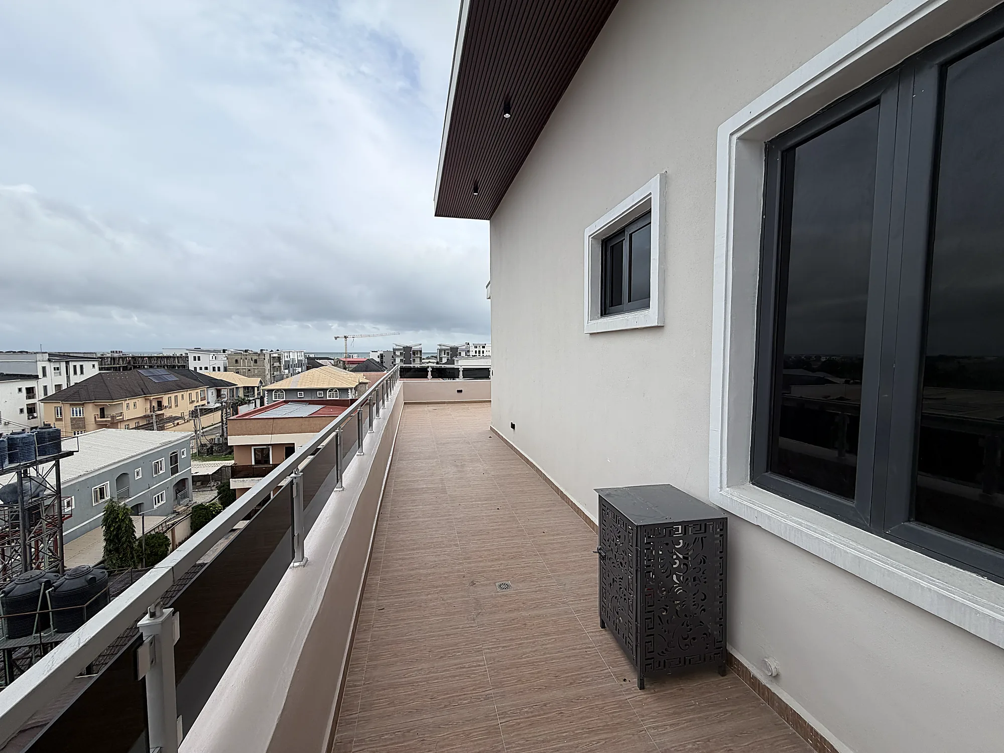 The terrace looking across Ilasan toward the coast, with the horizon visible