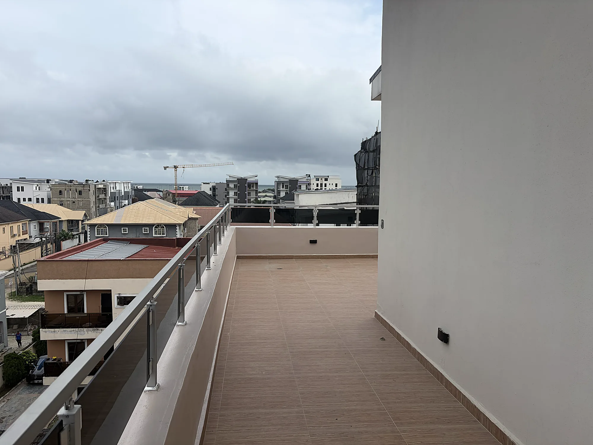 The terrace running the length of the penthouse, seen from the far end